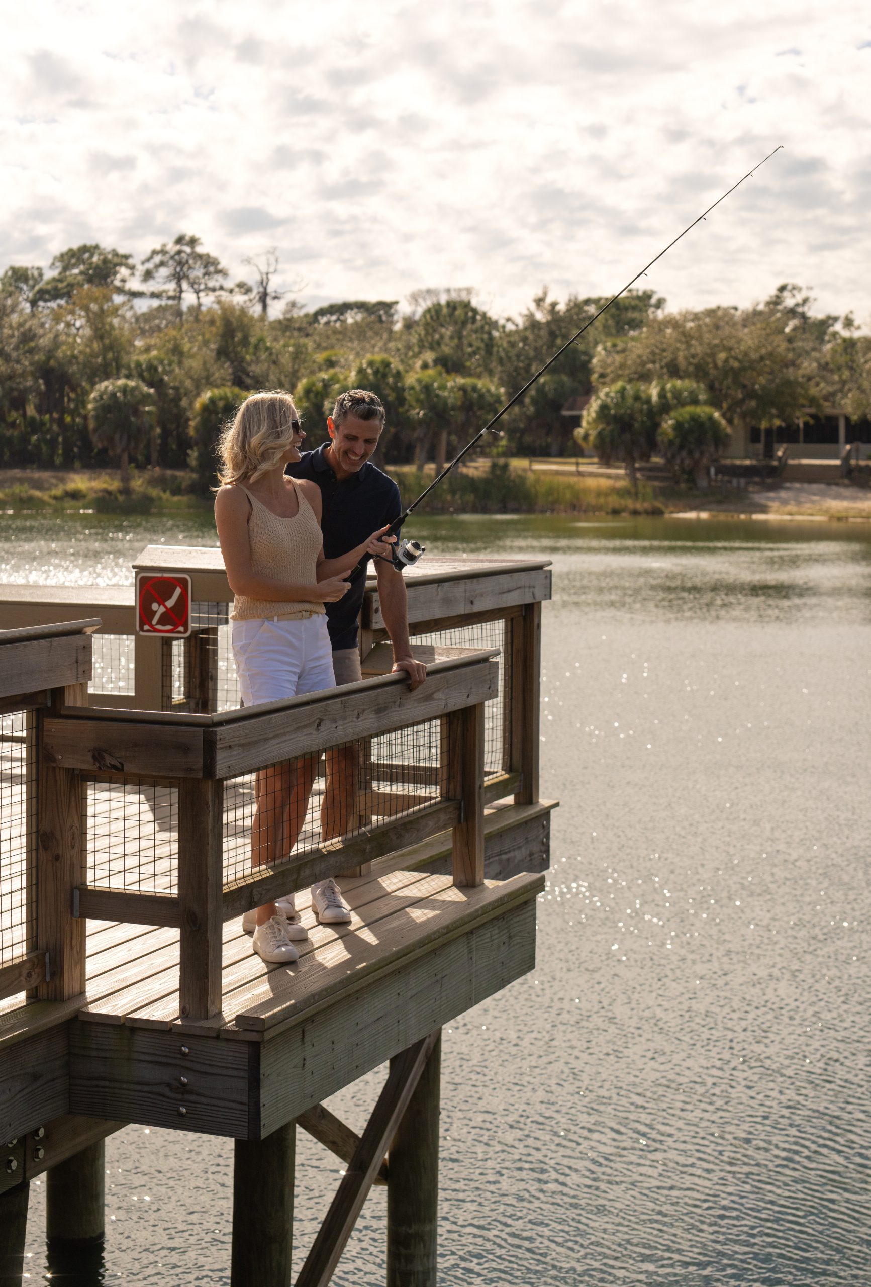 Man and woman fishing at Oscar Scherer State Park